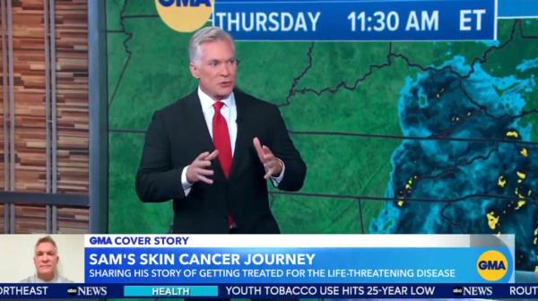 Sam Champion in front of a weather map. 