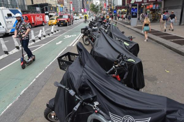 Migrant mopeds in Manhattan.