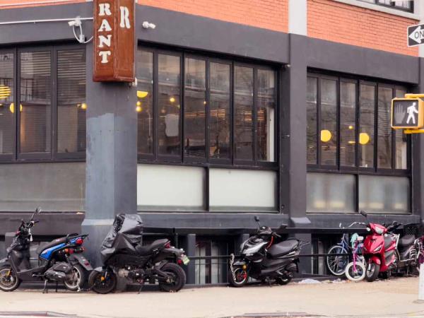 Migrants working late night food delivery shifts, as many do to get by, will be able to apply for curfew exemptions