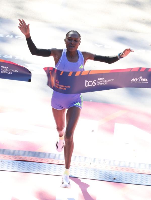 Sheila Chepkirui of Kenya crosses the finish line to win the women's division during the New York Marathon in New York City on November 3, 2024. 