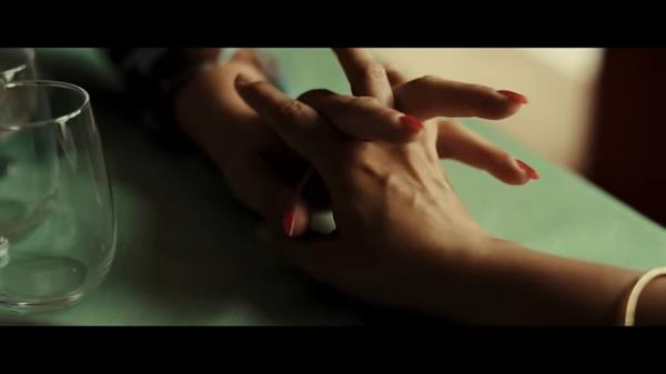 A close up of arms holding hands. 