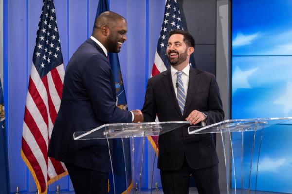 Jo<em></em>nes and Lawler shaking hands at a debate in Yo<em></em>nkers on Oct. 16, 2024.