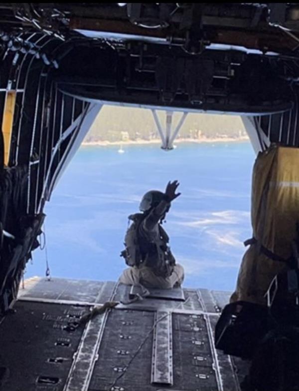 Alec Langen waving on an aircraft