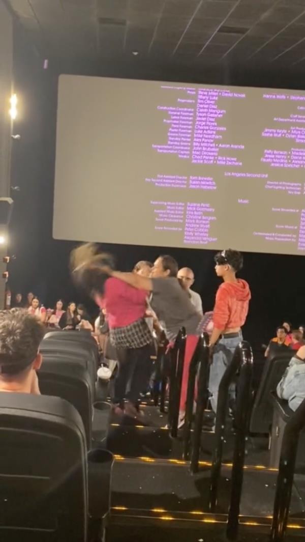 Things begin to escalate when the woman who allowed the child the phone pushes her accuser into the seats and falls down.