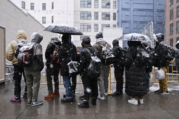 Migrants seen awaiting to be admitted into a Migrant Super Center 