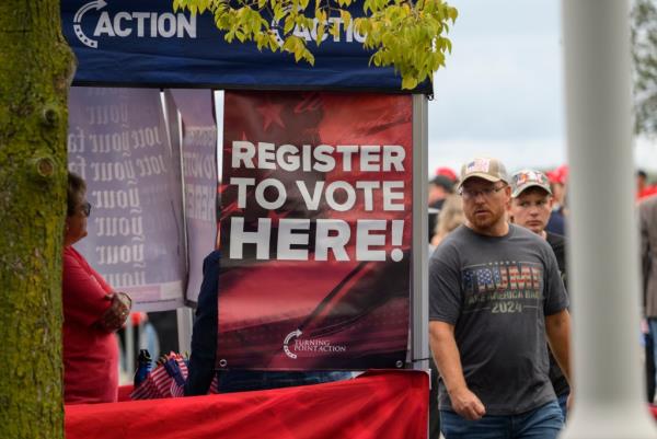 Sign promoting voter registration at the Bayfront Co<em></em>nvention Center in Erie, Pennsylvania before a campaign rally by former President Do<em></em>nald Trump
