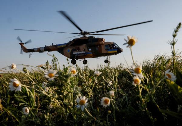A Ukrainian fighter pilot said that women are flashing air force helicopters as they do their daily flyovers to boost morale. 