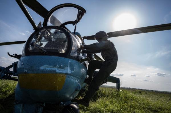 A Ukrainian pilot of the 12th Separate Brigade of Army Aviation prepares to take off to carry out a mission 