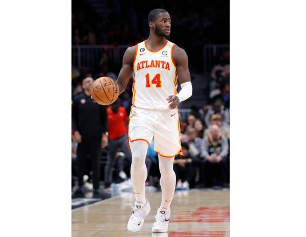A.J. Griffin, in his Atlanta Hawks uniform, dribbling a basketball during a game against the Detroit Pistons in 2023