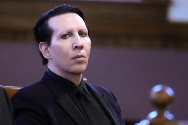 Musical artist Marilyn Manson, whose legal name is Brian Hugh Warner, waits for the judge to arrive in Belknap Superior Court,Monday, Sept. 18, 2023, in Laconia, N.H. 