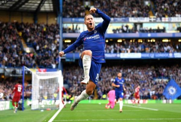 Eden Hazard of Chelsea celebrates after scoring his team's first goal during the Premier League match between Chelsea and Liverpool