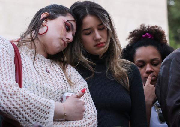 Tearful fans comforted each other at the vigil.