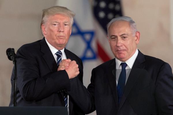 In this Tuesday, May 23, 2017, file photo, Israeli Prime Minister Benjamin Netanyahu, right, and US President Do<em></em>nald Trump shake hands at the Israel Museum in Jerusalem.