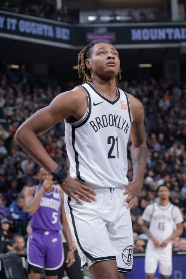 Noah Clowney #21 of the Brooklyn Nets  looks on during the game against the Sacramento Kings on November 24, 2024 at Golden 1 Center in Sacramento, California. 