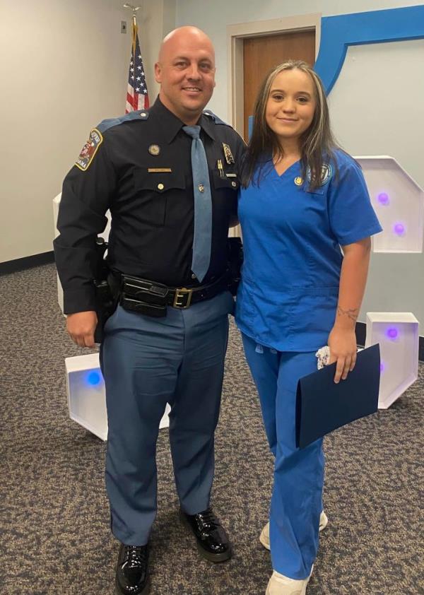 Alabama State Trooper J.T. Brown and Abbie Rutledge at her graduation ceremony.