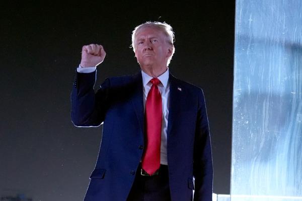 Former President Do<em></em>nald Trump gesturing while co<em></em>ncluding his speech at a campaign event at the Butler Farm Show in Butler, PA, on October 5, 2024