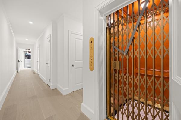 The eight story home has lots of original detail and includes an elevator. 