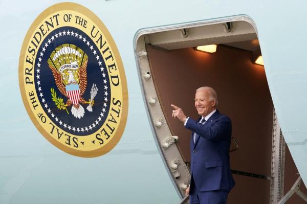 President Joe Biden points as he steps down from Air Force One, during his arrival in Los Angeles, California, U.S., February 20, 2024.