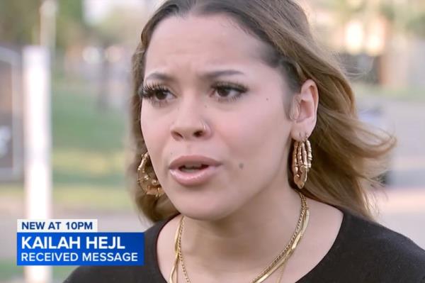 Kailah Hejl talks to a reporter after receiving the racist text on her phone.