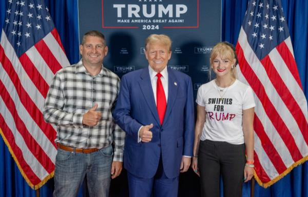 Taylor Swift fan, Jenna Piwowarczyk, posing with a group of people for a photo promoting 'Swifties for Trump'