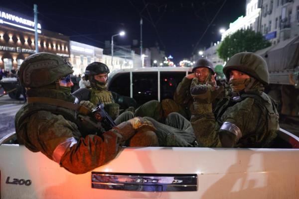 PMC Wagner fighters leave the headquarters of the Russian Southern Military District, June 24, 2023. 