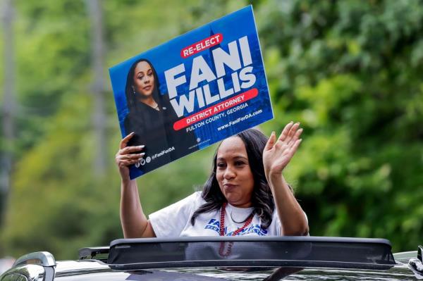 Fulton County District Attorney Fani Willis, who is running for reelection, participates in the parade for the 52nd Inman Park Festival