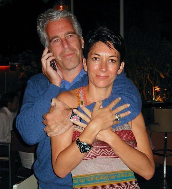 Jeffrey Epsteinon a mobile phone with his left arm around Ghislaine Maxwell.