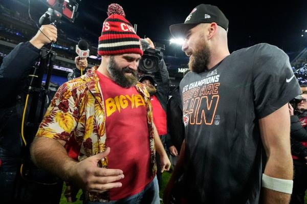 Jason Kelce, left, speaks with his brother Kansas City Chiefs tight end Travis Kelce after an AFC Champio<em></em>nship NFL football game against the Baltimore Ravens on Jan. 28 in Baltimore.
