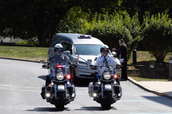 The hearse arriving at St. Mary Magdalen Catholic Church.