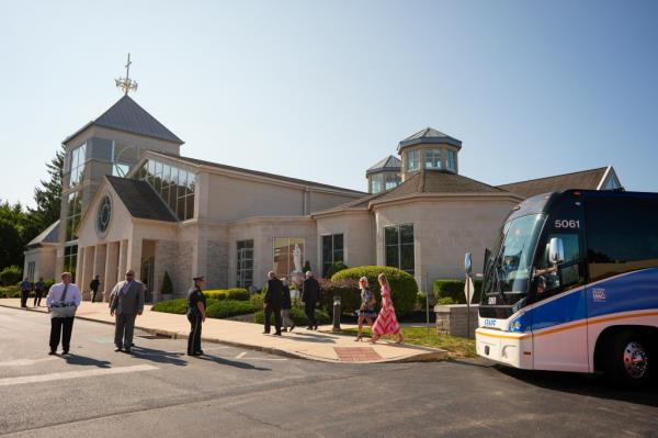 Mourners gathering at St. Mary Magdalen Catholic Church for the funeral service of Columbus Blue Jackets hockey players, John and Matthew Gaudreau.