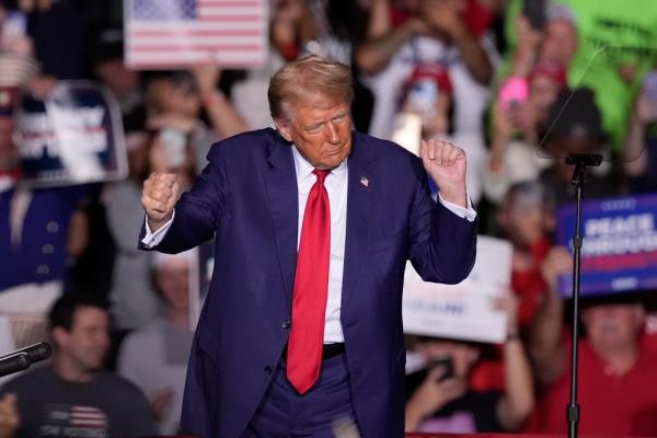 Do<em></em>nald Trump dances at a campaign event at the Ryder Center at Saginaw Valley State University, Thursday, Oct. 3, 2024, in University Center, Mich.