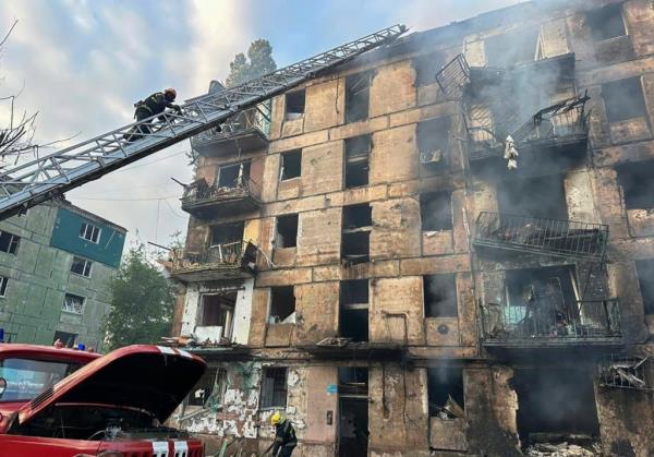 Emergency workers extinguish a fire after missiles hit a multi-story apartment building in Kryvyi Rih, Ukraine, on June 13, 2023.