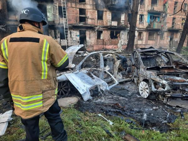 A firefighter extinguishes a fire on a five-story residential building, the site of the night Russian strike, in the city of Kryvyi Rig, on June 13, 2023. 
