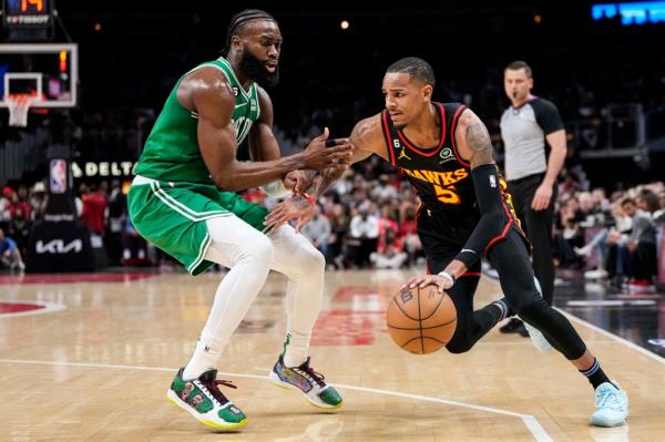  Hawks guard Dejounte Murray (5) dribbles against Boston Celtics guard Jaylen Brown