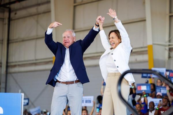 Vice presidential nominee Minnesota Gov. Tim Walz and Harris at a rally in Detroit on Aug. 7, 2024.