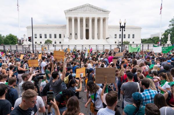 Demo<em></em>nstrators rally in front of the Supreme Court