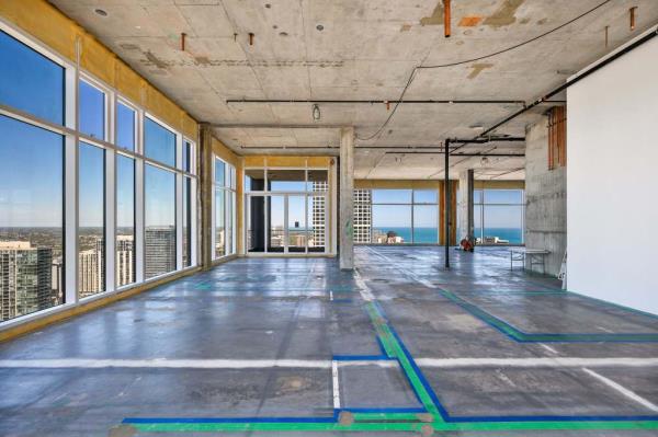 The No. 9 Walton units, comprising 15,000 square feet and luxury amenities, remain unfinished and were originally intended as a customized penthouse project that never materialized.