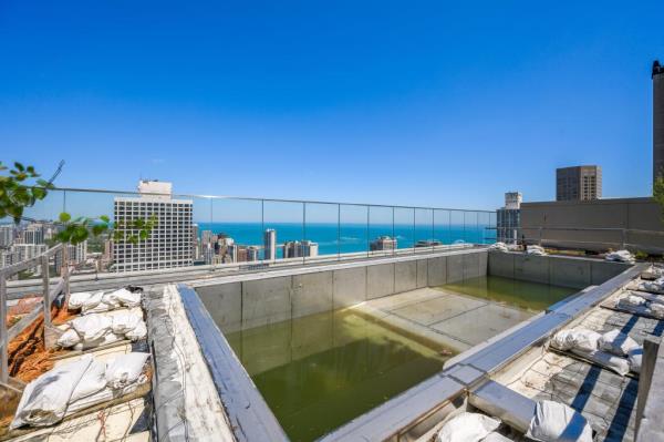 The penthouse units boasts a pool that remains unfinished. 