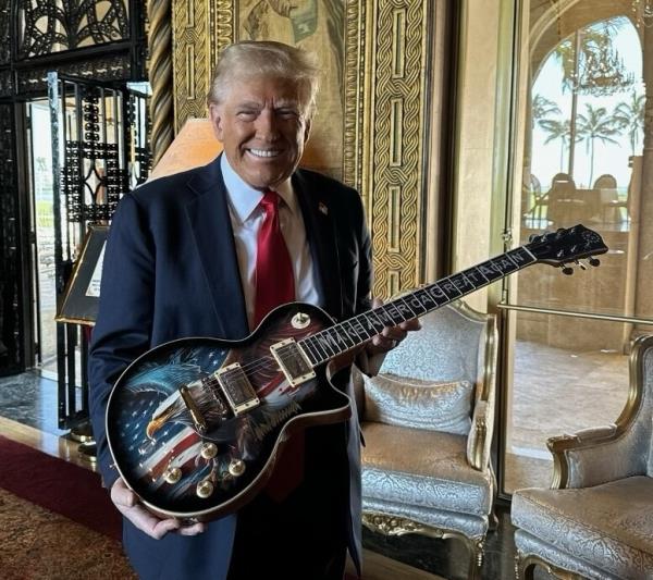 President-elect Do<em></em>nald Trump poses with a Trump branded guitar in his latest venture.
