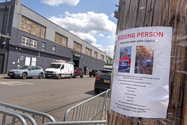 A missing person's flyer taped to a telephone poll.