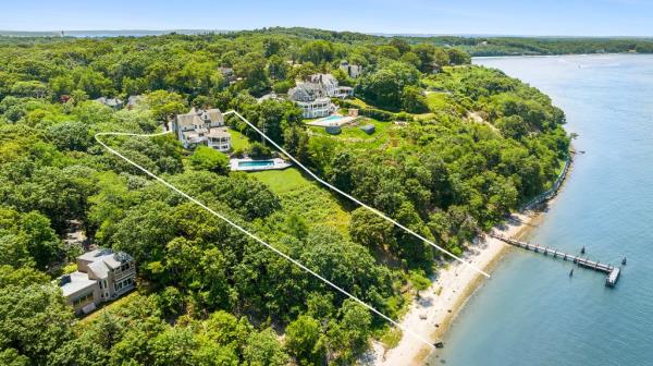 The waterfront property is situated on 1.2 acres of land. 