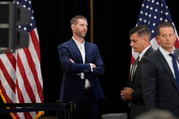 Eric Trump observing former President Do<em></em>nald Trump engaging in a roundtable discussion with Latino leaders on October 22, 2024, in Doral, Florida