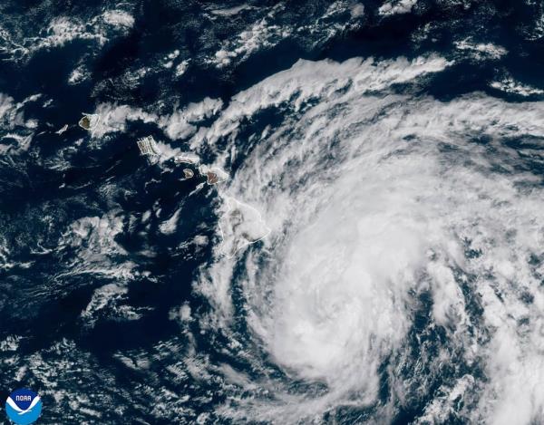 This image taken on Saturday provided by the Natio<em></em>nal Oceanic and Atmospheric Administration shows the storm eying the Hawaiian Islands.
