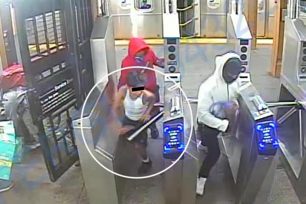 Surveillance image of an 11-year-old Venezuelan migrant child and a group of teens, in masks and hoodies, suspected of cellphone robbery in Vernon Jackson subway station.