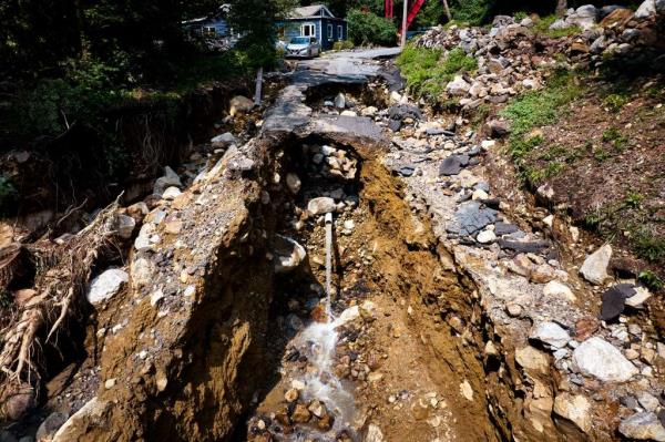 The road Pamela was swept down to her death had been gauged away by the raging floodwaters on Sunday evening