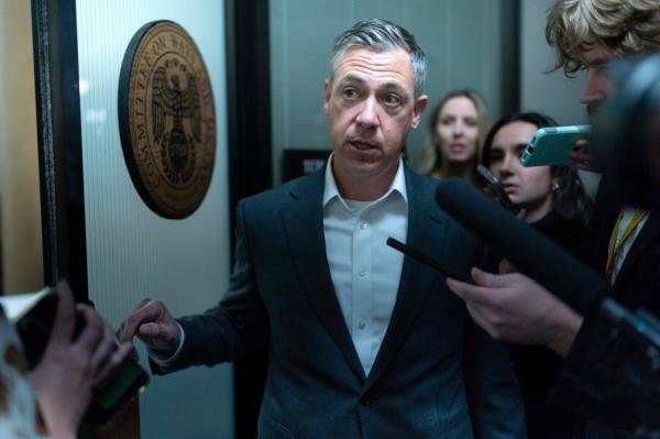 Rep. Jim Banks R-Ind., talks to reporters as he arrives to the Republican caucus meeting at the Capitol in Washington, Tuesday, Oct. 24, 2023. 