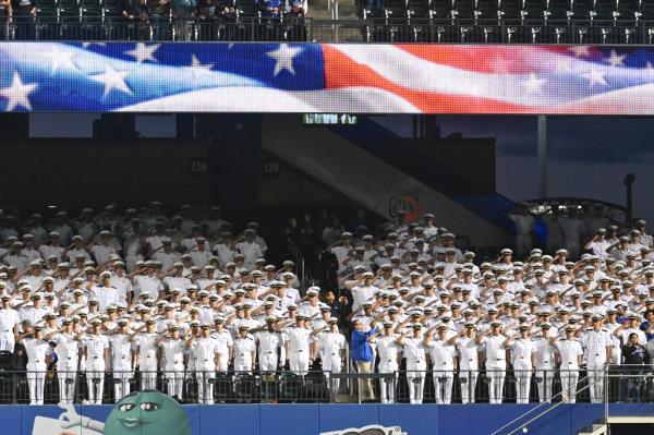 Members of the United States Merchant Marine Academy salute during the Natio<em></em>nal Anthem before the game when the New York Mets played the Miami Marlins Thursday, Sept. 30, 2021, at Citi Field in Queens.