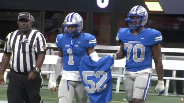 Smith's teammates carried his jersey as they walked o<em></em>nto the field at the Falcon's Mercedes Benz Stadium.