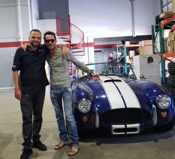 Vega (left) with soccer icon David Beckham.