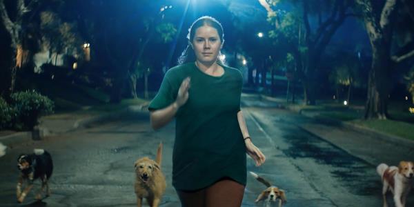 Amy Adams running with dogs